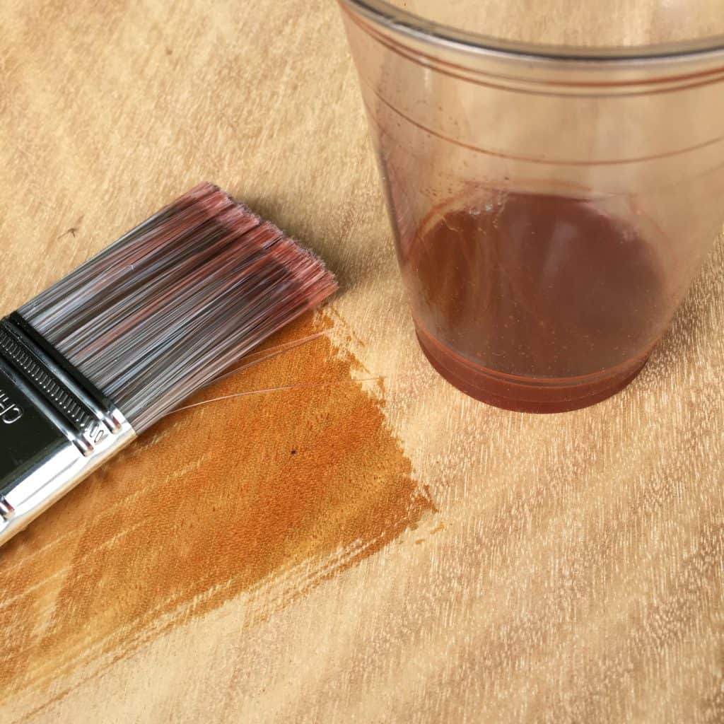 The red in the cup seems a little mellowed out on the wood itself.